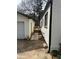 Shot of the side of the home showing sidewalk and new back deck at 684 S Hairston Rd, Stone Mountain, GA 30088