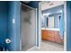 Shower and vanity area, complemented by blue walls that add character to the space at 4612 Liberty Square Dr, Acworth, GA 30101