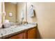 Elegant half bathroom features granite countertops, and a decorative mirror at 4612 Liberty Square Dr, Acworth, GA 30101