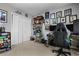 Versatile bedroom or office with shelving, artwork, and gaming setup, offering a great personal space at 4612 Liberty Square Dr, Acworth, GA 30101