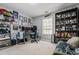 Versatile bedroom or office with shelving, artwork, and gaming setup at 4612 Liberty Square Dr, Acworth, GA 30101