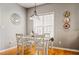 Bright dining area featuring a white table, chairs, and ample natural light at 4612 Liberty Square Dr, Acworth, GA 30101
