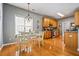 Open concept kitchen and dining area featuring stainless appliances and a white table at 4612 Liberty Square Dr, Acworth, GA 30101