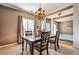 Inviting dining room with classic chandelier and plenty of room for entertaining guests at 4612 Liberty Square Dr, Acworth, GA 30101