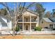 Two-story home with a welcoming double balcony and a charming white picket fence at 4612 Liberty Square Dr, Acworth, GA 30101