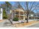 Inviting two-story home with double balconies, a manicured lawn and a white picket fence at 4612 Liberty Square Dr, Acworth, GA 30101