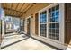 Cozy front porch with seating, stylish lighting, and a decorative wreath on the front door at 4612 Liberty Square Dr, Acworth, GA 30101
