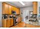 Well-lit kitchen features stainless steel appliances, granite countertops, and wooden cabinets at 4612 Liberty Square Dr, Acworth, GA 30101