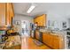 Bright kitchen features wooden floors, granite countertops, and stainless steel appliances at 4612 Liberty Square Dr, Acworth, GA 30101