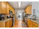 Well-lit kitchen featuring wood cabinets, stainless steel appliances, and granite countertops at 4612 Liberty Square Dr, Acworth, GA 30101