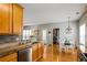 Open concept kitchen with stainless appliances, granite countertops, and a view of the dining area at 4612 Liberty Square Dr, Acworth, GA 30101