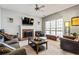 Cozy living room features a fireplace, comfortable seating, and a large window at 4612 Liberty Square Dr, Acworth, GA 30101