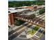 Aerial view of downtown Acworth featuring a pedestrian bridge over railroad tracks and charming brick buildings at 4755 Fowler St, Acworth, GA 30101