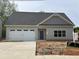 Charming single story home featuring a spacious two car garage and a classic craftsman exterior at 4755 Fowler St, Acworth, GA 30101