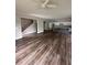 Spacious living room showcasing beautiful hardwood floors, a staircase and adjacent kitchen at 4755 Fowler St, Acworth, GA 30101