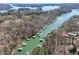 Aerial view showing a scenic lake community with numerous docks and waterfront homes at 5305 Pilgrim Point Rd, Cumming, GA 30041