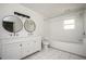 Renovated bathroom with subway tile surround, double sinks, and modern fixtures at 5305 Pilgrim Point Rd, Cumming, GA 30041