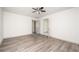 Spacious bedroom with wood flooring and an open doorway at 5305 Pilgrim Point Rd, Cumming, GA 30041