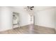 Bright bedroom with ceiling fan, wood flooring, and an en-suite bathroom at 5305 Pilgrim Point Rd, Cumming, GA 30041