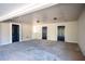 Spacious carport with three entry doors and ample parking for vehicles and storage at 5305 Pilgrim Point Rd, Cumming, GA 30041