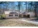 Charming ranch-style home with a cozy, covered carport and a well-maintained lawn at 5305 Pilgrim Point Rd, Cumming, GA 30041