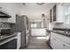 Spacious kitchen featuring stainless steel appliances, granite countertops, and an open layout at 5305 Pilgrim Point Rd, Cumming, GA 30041