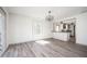 Open living space with a sliding door to a deck and an open breakfast bar to the kitchen at 5305 Pilgrim Point Rd, Cumming, GA 30041