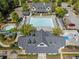 Aerial view of the community pool, clubhouse, and surrounding landscape at 78 Cuthbert Ln Ne, Acworth, GA 30101