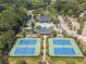 Aerial view of the community's amenities with tennis courts and a pool at 78 Cuthbert Ln Ne, Acworth, GA 30101