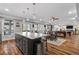Open basement layout with a kitchen island, dining area, and entertainment space for flexible living at 78 Cuthbert Ln Ne, Acworth, GA 30101
