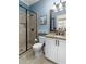 Bright bathroom featuring a tiled shower, granite countertops, and white cabinetry at 78 Cuthbert Ln Ne, Acworth, GA 30101