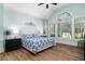 Bright bedroom with vaulted ceilings, large window, and a luxurious bed with stylish bedding at 78 Cuthbert Ln Ne, Acworth, GA 30101