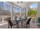 Covered porch area with a table and chairs, ideal for outdoor dining and entertaining with view of the yard at 78 Cuthbert Ln Ne, Acworth, GA 30101