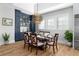 Bright dining room features hardwood floors, a modern light fixture, and a custom built-in bar area at 78 Cuthbert Ln Ne, Acworth, GA 30101