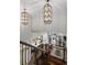 Elegant entryway with soaring ceilings, decorative chandeliers, and a view of the kitchen and living area at 78 Cuthbert Ln Ne, Acworth, GA 30101
