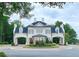 Elegant white home with arched entryways, lush landscaping and manicured roundabout at 78 Cuthbert Ln Ne, Acworth, GA 30101