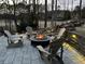 Cozy fire pit area with comfortable Adirondack chairs for outdoor gathering and relaxation at 78 Cuthbert Ln Ne, Acworth, GA 30101
