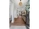 Inviting foyer with hardwood flooring, decorative lighting, and elegant console table at 78 Cuthbert Ln Ne, Acworth, GA 30101