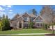 Charming two-story home with stone facade, manicured lawn, and professional landscaping at 78 Cuthbert Ln Ne, Acworth, GA 30101