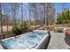 Backyard features a hot tub, outdoor lounge area, and professional landscaping at 78 Cuthbert Ln Ne, Acworth, GA 30101