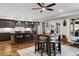 Stylish kitchen with dark cabinets, granite countertops, stainless steel appliances, and an island with seating at 78 Cuthbert Ln Ne, Acworth, GA 30101