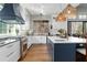 Gourmet kitchen with a center island, white cabinets, a stainless steel stove, and pendant lighting at 78 Cuthbert Ln Ne, Acworth, GA 30101