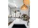 Close-up of a modern kitchen featuring stainless steel appliances, quartz countertops, and a garden window at 78 Cuthbert Ln Ne, Acworth, GA 30101