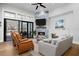 Comfortable living room with a fireplace, hardwood floors, and a screened porch at 78 Cuthbert Ln Ne, Acworth, GA 30101