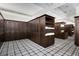 Well-appointed locker room features dark wood lockers and neutral-toned carpeting at 78 Cuthbert Ln Ne, Acworth, GA 30101