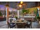 Inviting outdoor dining area with an elegant table set and adjacent jacuzzi at 78 Cuthbert Ln Ne, Acworth, GA 30101
