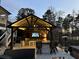 Entertainers backyard showcasing an outdoor kitchen and bar area with a built-in grill and TV at 78 Cuthbert Ln Ne, Acworth, GA 30101