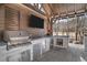 Outdoor kitchen features a grill, sink, stainless steel drawers, under-counter refrigerator, and a TV at 78 Cuthbert Ln Ne, Acworth, GA 30101