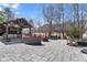 Outdoor kitchen with covered grill, bar, integrated seating, and adjacent spa at 78 Cuthbert Ln Ne, Acworth, GA 30101