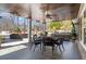 Outdoor patio with a dining area, wood ceiling, and a view of the landscaped backyard at 78 Cuthbert Ln Ne, Acworth, GA 30101